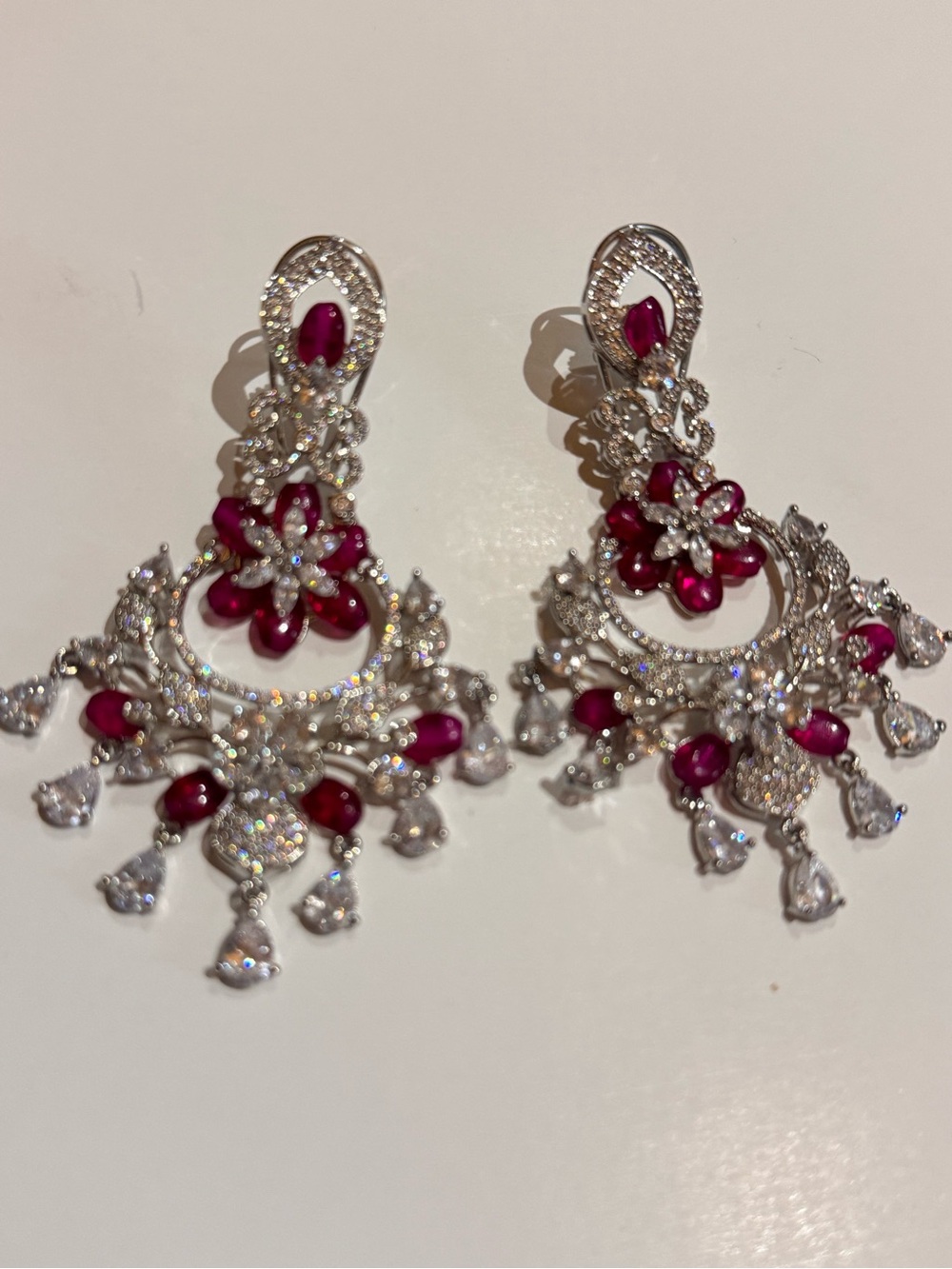 Beautiful sparkly silver tone, rhinestone and ruby pink pierced earring